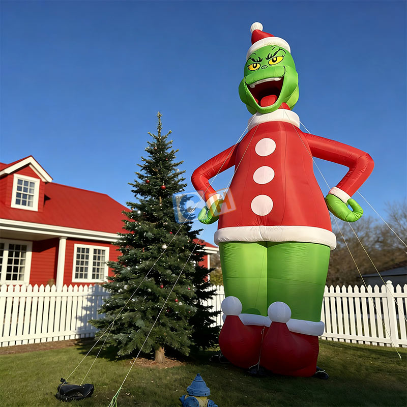 Large inflatable Grinch in Santa costume for outdoor Christmas yard decoration
