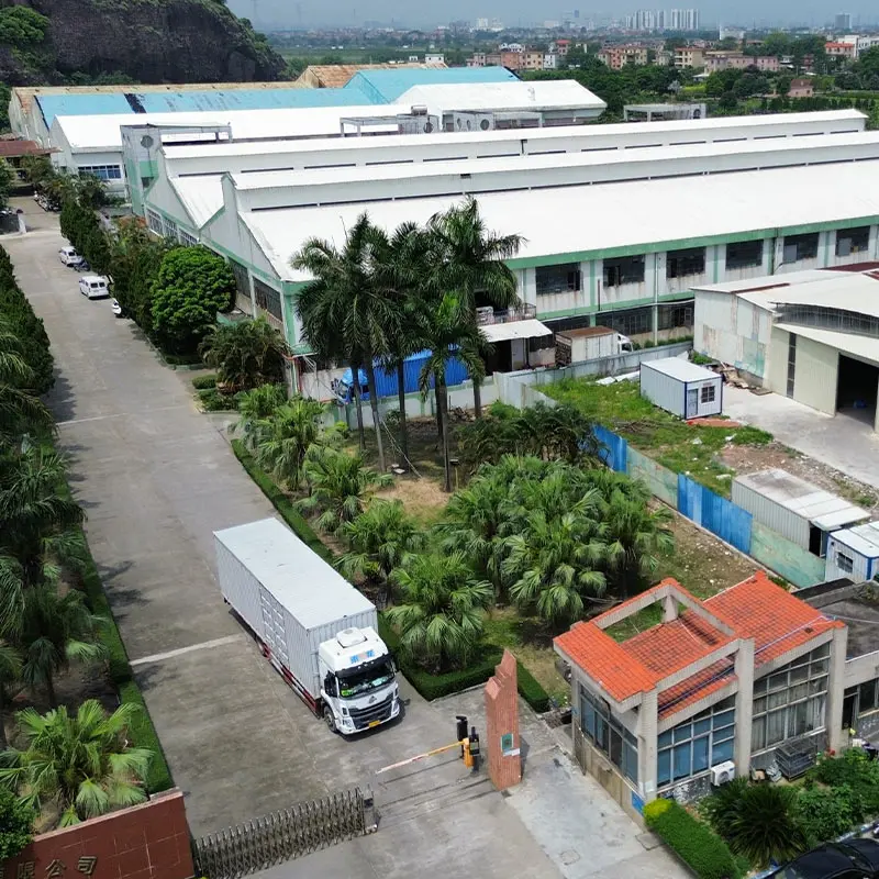 Aerial overhead shot of inflatable products manufacturing factory exterior with warehouse buildings